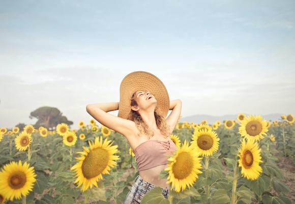 Woman standing on sunflower field 3764579